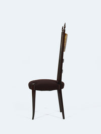 A chair with a high backrest by designer Aldo Tura